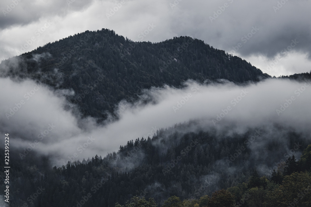 Mountains with clouds and trees