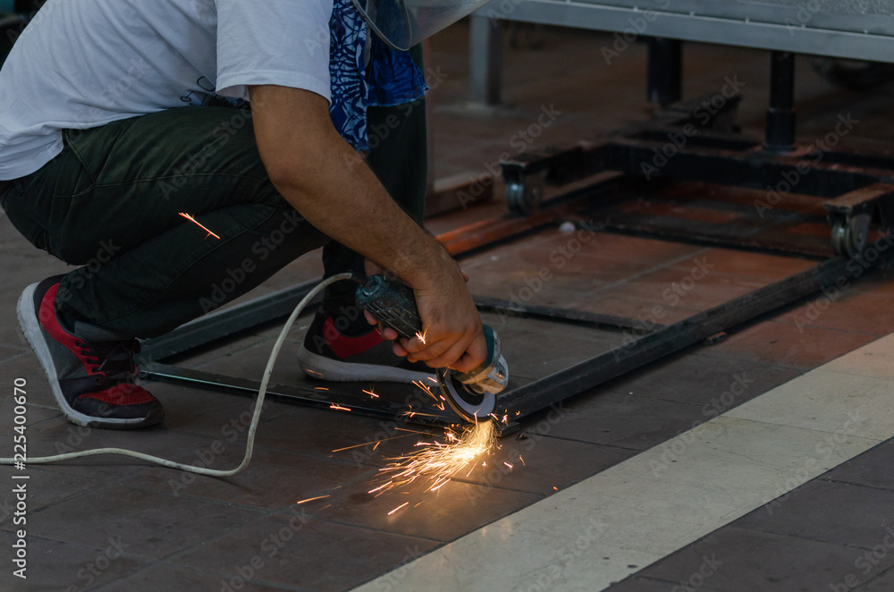 Worker welding the steel part by manual Worker welding the steel part by manual