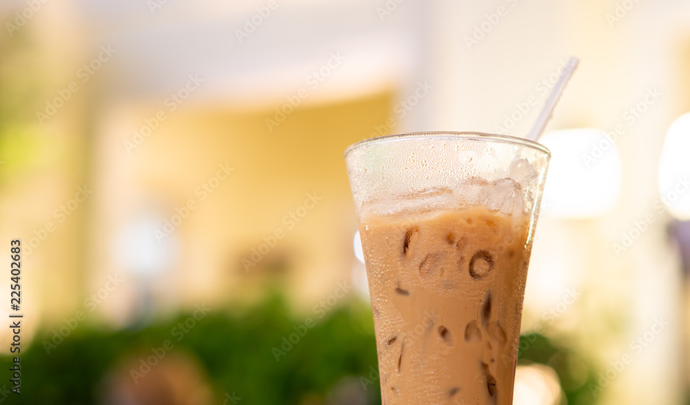 Close up glass of coffee on the table in the outdoor luxury restaurant, bar cold fresh drink background with copy space Close up glass of coffee on the table in the outdoor luxury restaurant, bar cold fresh drink background with copy space