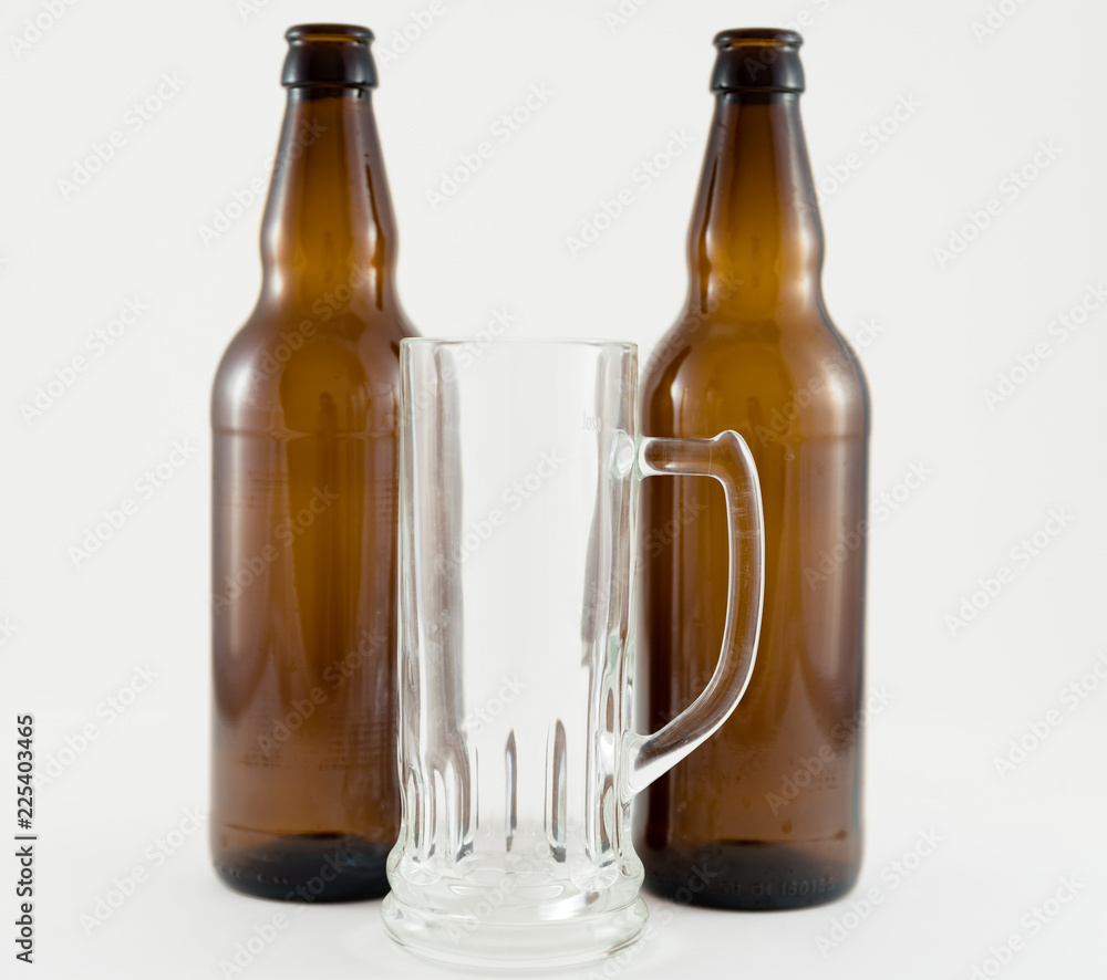 beer bottles with glass cup on white background
