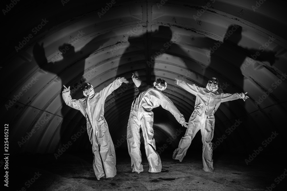 Fototapeta premium Ghosts in dark tunnel of nuclear power plant
