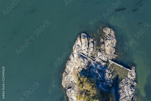 Aerial view of a rocky coatline with claer ocean on Vancouver Island, Canada