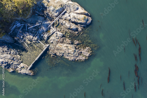Aerial view of a rocky coatline with claer ocean on Vancouver Island, Canada photo