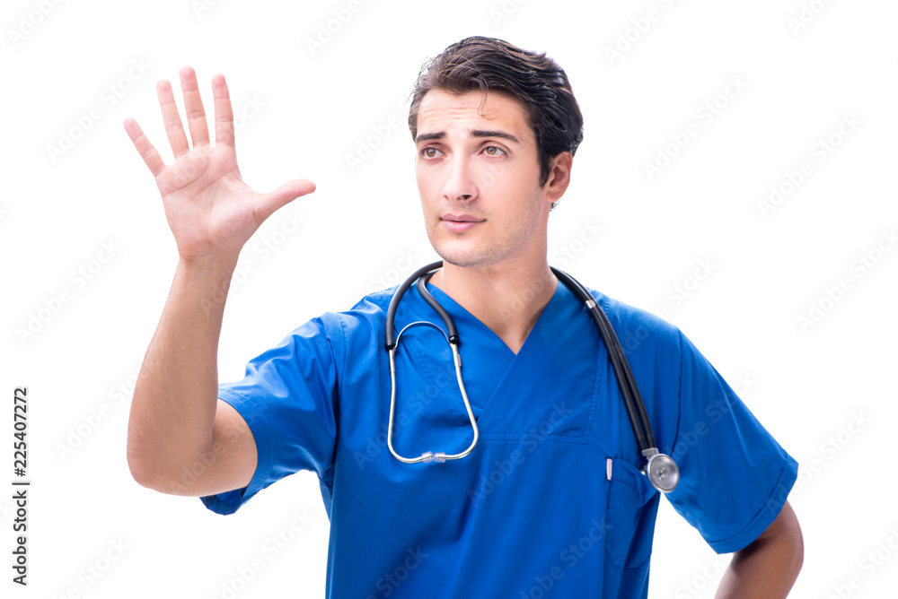 Young male doctor pressing buttons isolated on white Young male doctor pressing buttons isolated on white
