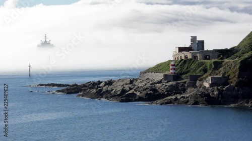 Royal Navy warship covered in sea mist at fort Bovisands looking spooky. Plymouth England. photo