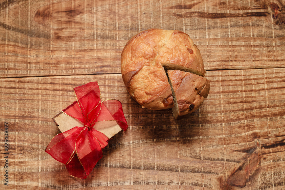 panettone cut with rustic wooden board , top view panettone cut with rustic wooden board , top view