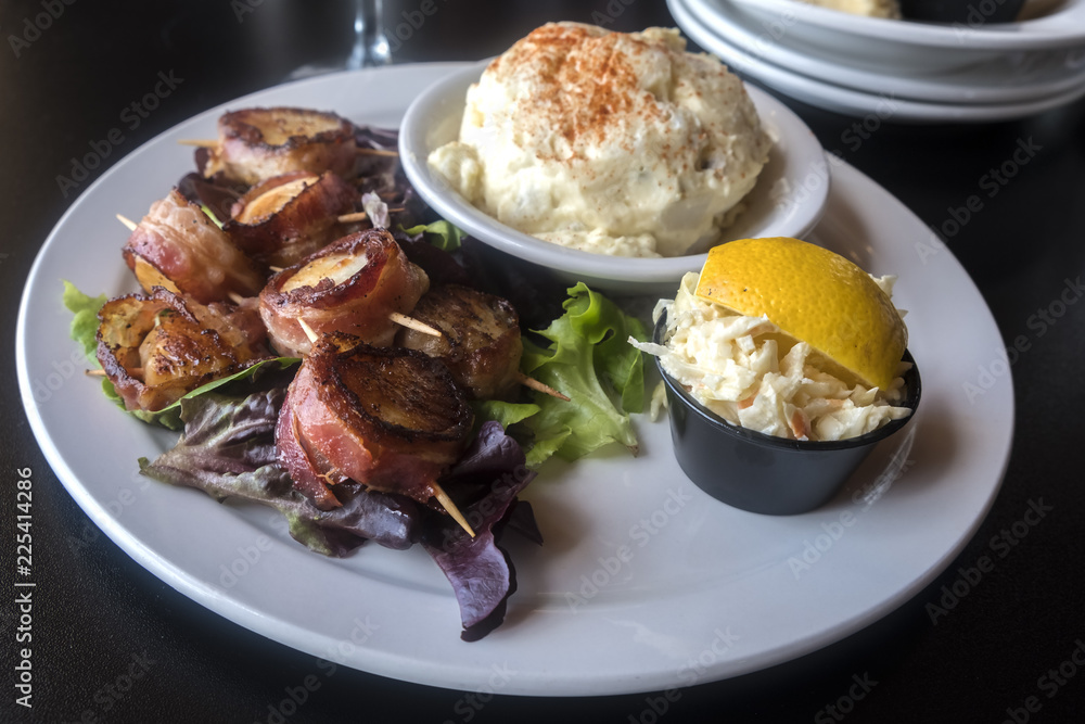 Grilled Bacon Wrapped Scallops Served With Coleslaw and Creamy Potato Salad Grilled Bacon Wrapped Scallops Served With Coleslaw and Creamy Potato Salad