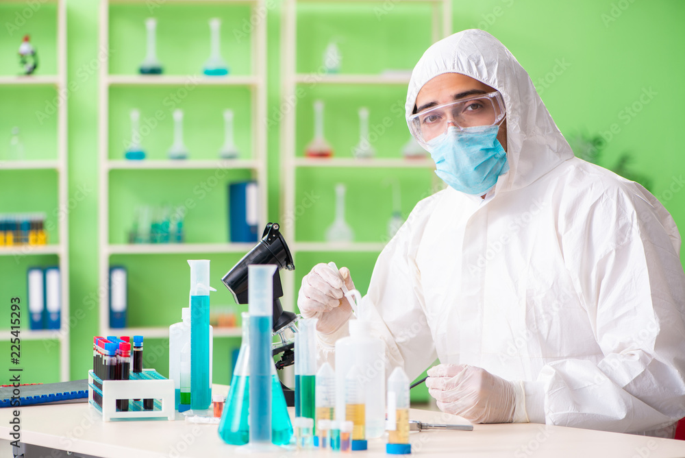 Chemist working in the lab on new experiment Chemist working in the lab on new experiment