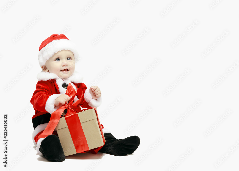 Santa Claus baby in red christmas clothes with gift box isolated on white Santa Claus baby in red christmas clothes with gift box isolated on white
