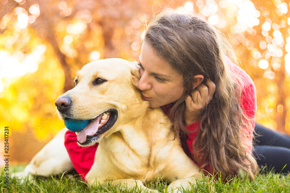 Young smiling woman with her dog Young smiling woman with her dog