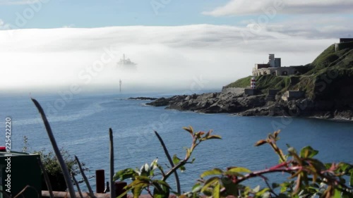 Royal Navy warship in the mist at Fort Bovisands, Plymouth England. photo