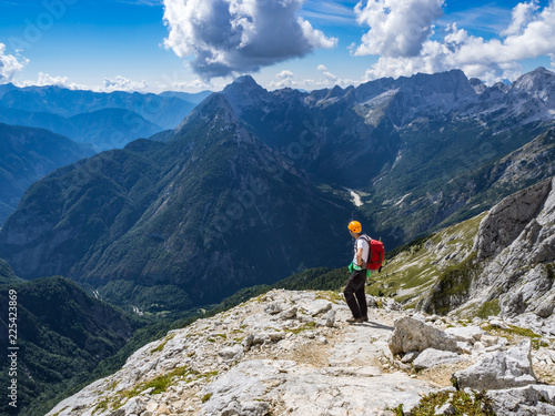 The mountaineer enjoying the view from the Prisank mountain in Julian Alps, Slovenia