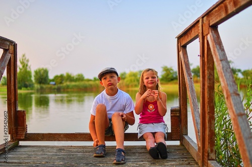 Photos Children sitting on pier
