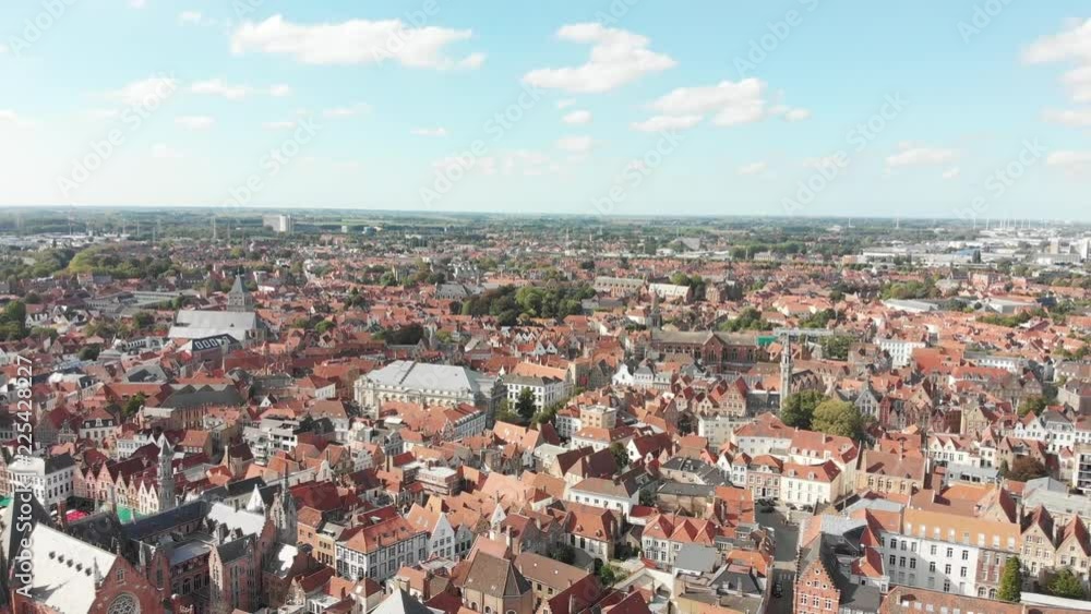 Aerial panoramic view of the streets of Bruges, Belgium - a World Heritage Site of Unesco - with views of old houses with drone flying forward. Aerial panoramic view of the streets of Bruges, Belgium - a World Heritage Site of Unesco - with views of old houses with drone flying forward.