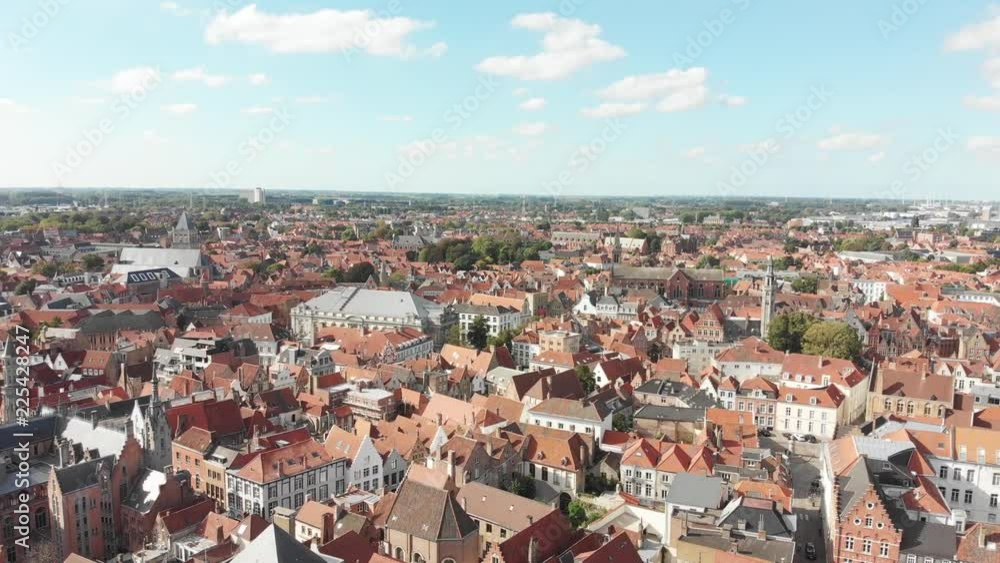 Aerial panoramic view of the streets of Bruges, Belgium - a World Heritage Site of Unesco - with views of old houses with drone flying forward. Aerial panoramic view of the streets of Bruges, Belgium - a World Heritage Site of Unesco - with views of old houses with drone flying forward.
