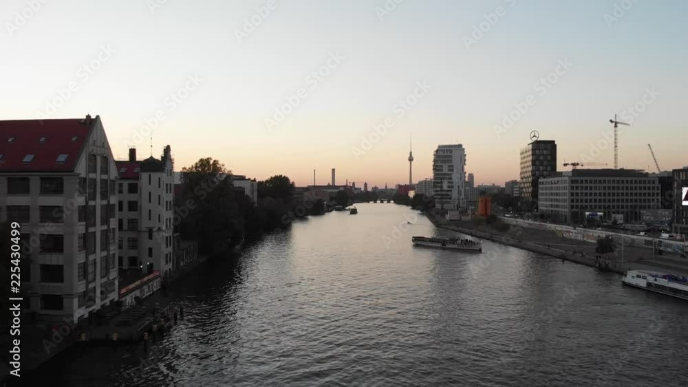 Aerial view of the East Side Gallery in Berlin over the Spree River during the sunset Aerial view of the East Side Gallery in Berlin over the Spree River during the sunset