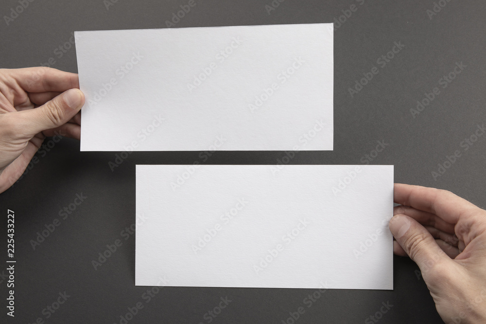 Fototapeta premium Mens hands holding white flyers