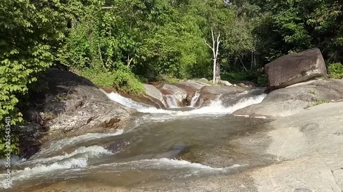 Paya Lintah waterfall located in Padang Rengas, in the state of Perak, Malaysia. There are two attractions that are rocks and waterfalls in the lower as well as pools and ponds in  center (above). photo