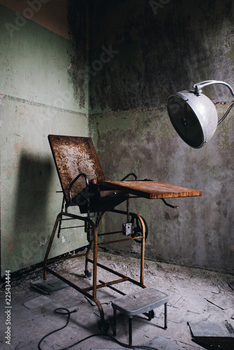 Derelict & Grimy Gynecological Examination Chair - Abandoned Westborough State Hospital - Massachusetts photo
