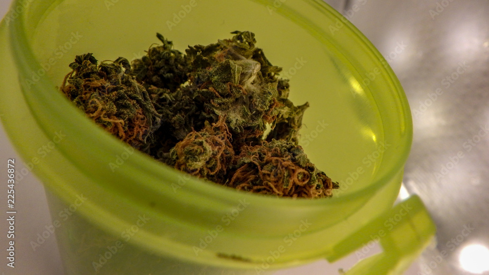 Close up of the top of a RX bottle filled with medical marijuana that is about to be sold in pharmacies nation wide in Canada