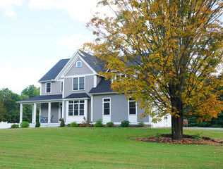 landscape of luxury house with autumn yellow tree