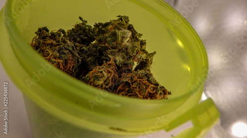 Obraz na płótnie Close up of the top of a RX bottle filled with medical marijuana that is about to be sold in pharmacies nation wide in Canada w salonie