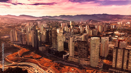 Aerial view of Santa Fe Mexico buildings and skyscrapers with mountain as background 