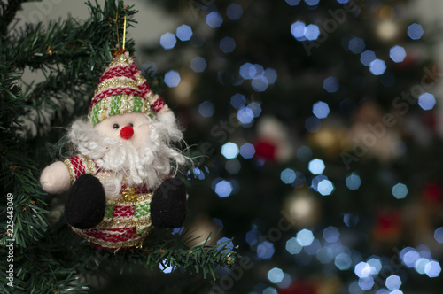 Santa with christmas tree in the background - Christmas props - Christmas tree - Santa Claus