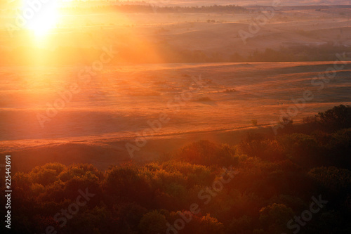 autumn landscape in the early morning with the sun