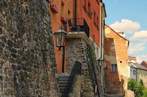 View of the back of the residential houses in Loket. Their walls use medieval stone fortifications. Bohemia, Sokolov, Karlovarsky Region, Czech Republic photo