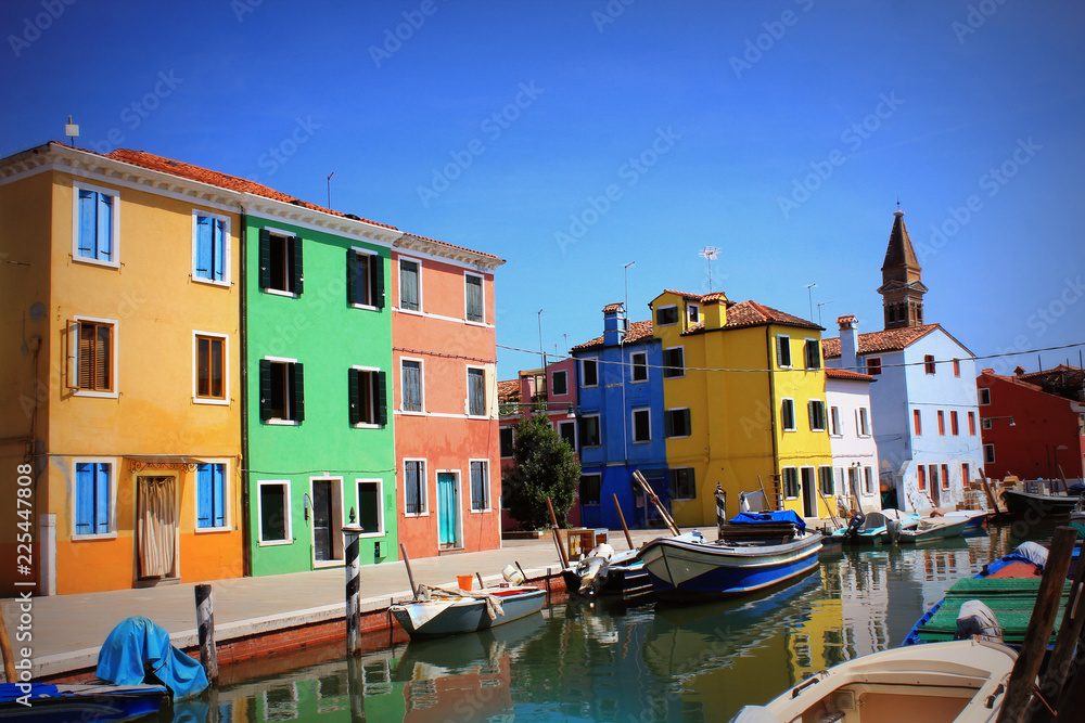 Street with colorful buildings in Burano island, Venice, Italy