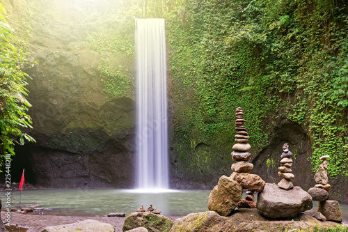 Long exposure Tibumana waterfall and stack of rock, Bangli, Bali Indonesia