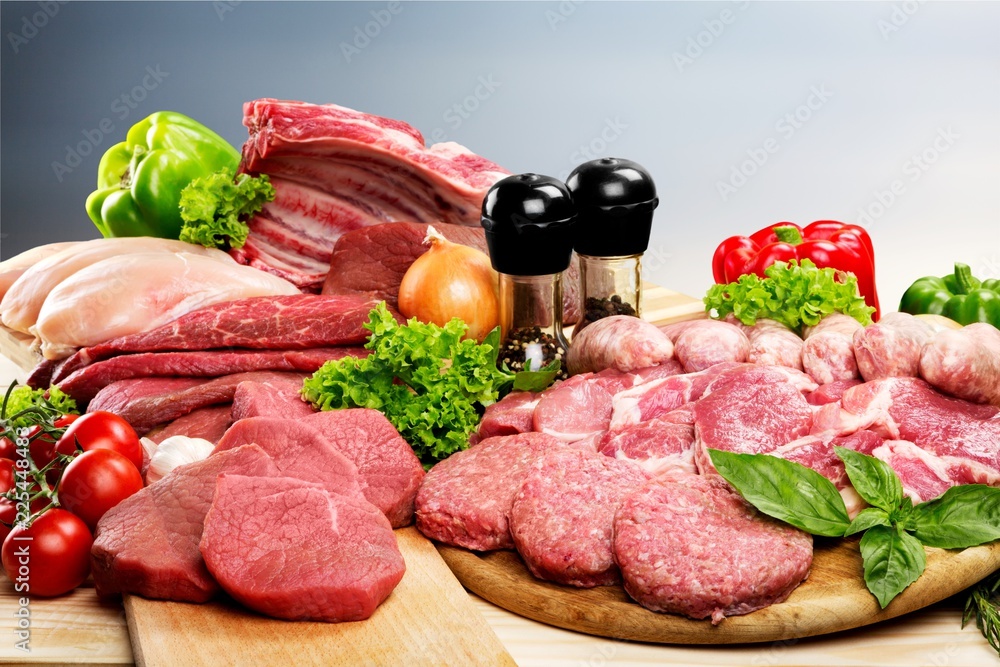 Fresh Raw Meat Background with vegetables Fresh Raw Meat Background with vegetables