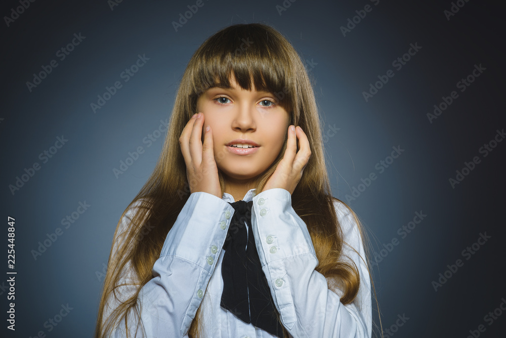 Closeup sad girl with worried stressed face expression Closeup sad girl with worried stressed face expression