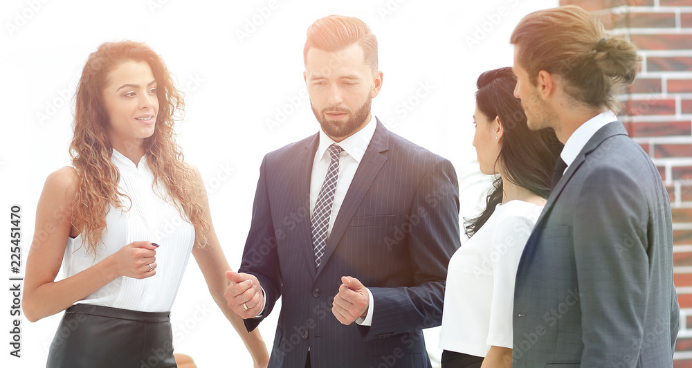 smiling business team talking, standing in office smiling business team talking, standing in office