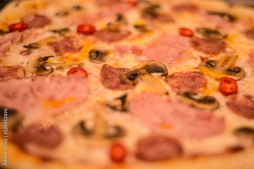 wrong high-calorie food: prepared fresh made pizza with sausage, mushrooms, mozzarella and spices wrong high-calorie food: prepared fresh made pizza with sausage, mushrooms, mozzarella and spices