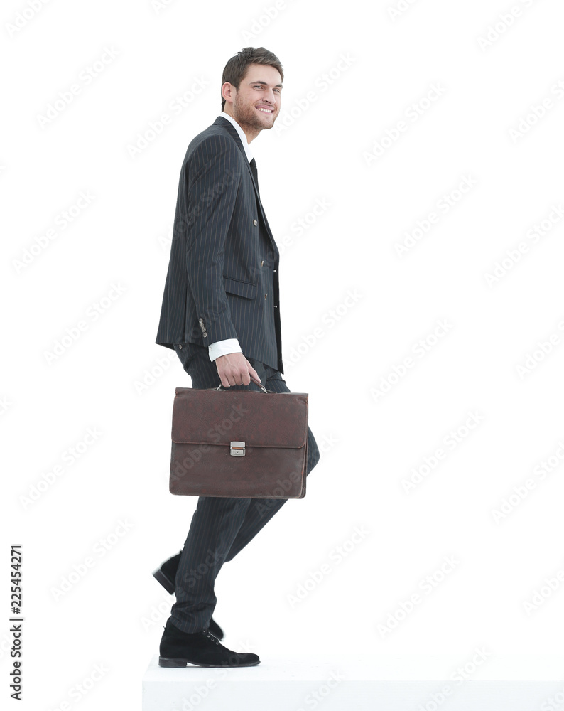 in full growth. a businessman with a leather briefcase walks up. in full growth. a businessman with a leather briefcase walks up.
