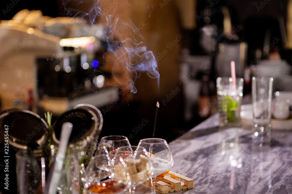 Aromatic smoke sticks on bar counter. Aromatic smoke sticks on bar counter.