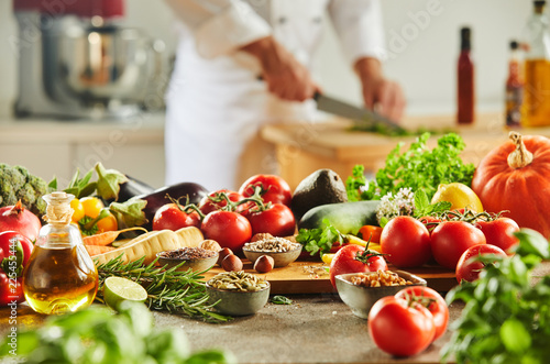 Cutting board with food and man in background