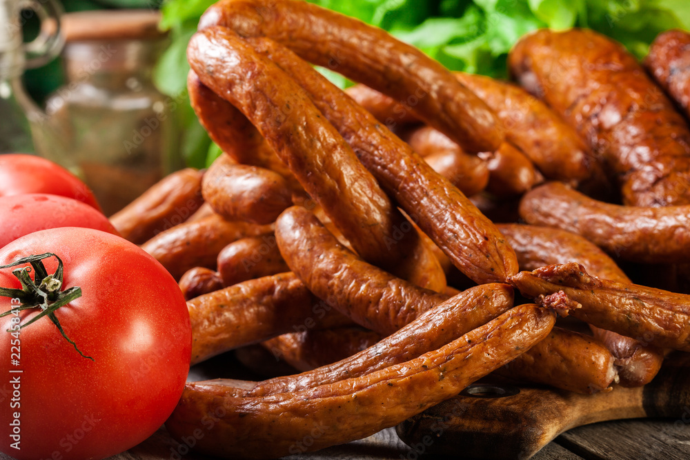 Assorted smoked sausages on a cutting board