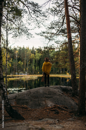 Young woman with hat at national park near lake © xan844