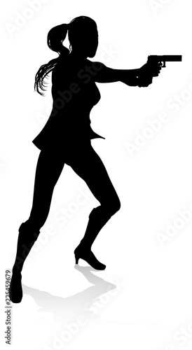 Silhouette woman in an action movie film shoot out pose