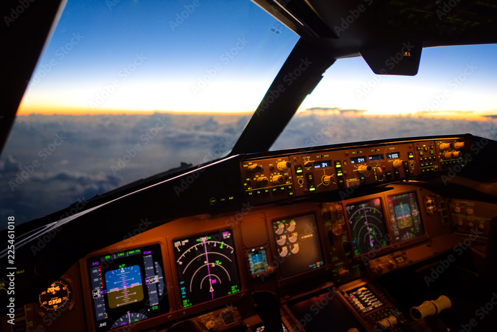 The view from commercial airplane, seen from captain seat in cockpit in the  morning twilight during flying above the cloud over the ocean. Modern  aviation concept. Stock Photo | Adobe Stock