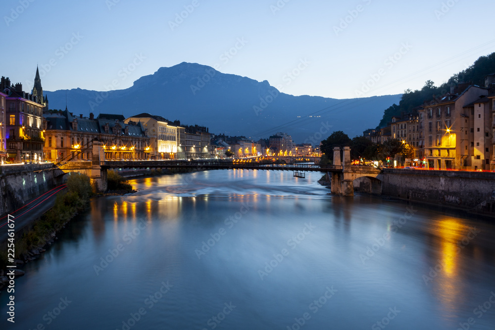 Grenoble at dusk with the river Isere, France