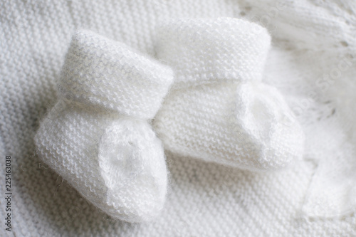 Home knitted baby booties white