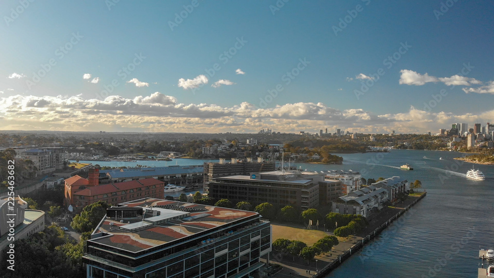 Fototapeta premium SYDNEY, AUSTRALIA - AUGUST 19, 2018: City skyline aerial view from Darling Harbour. Sydney attracts 15 million tourists annually