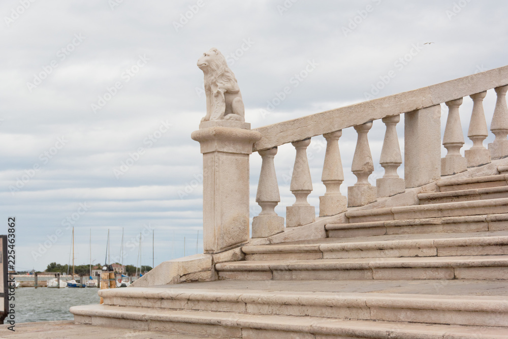 Fototapeta premium Chioggia, Italy-August 26, 2018: Province of Venice. monument on the city street.