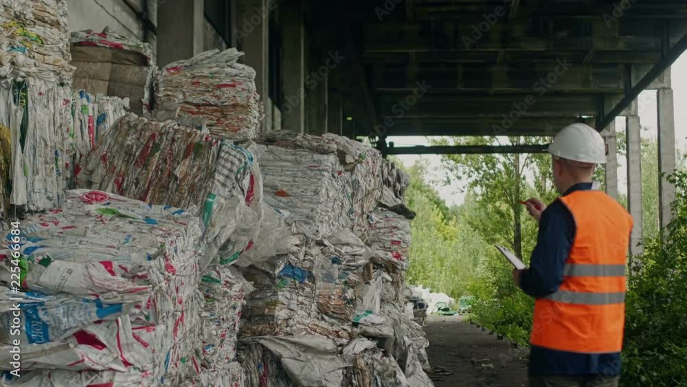 auditor and packed garbage of polyethylene in recycling company auditor and packed garbage of polyethylene in recycling company