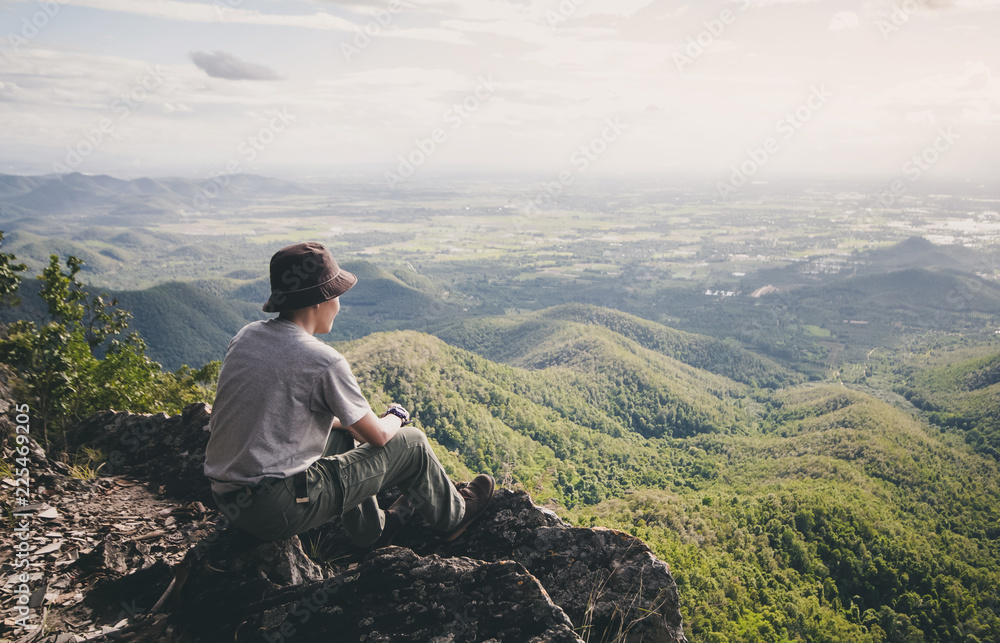 Man hiker of tourist on mountain is cloud and sky beautiful landscape Man hiker of tourist on mountain is cloud and sky beautiful landscape