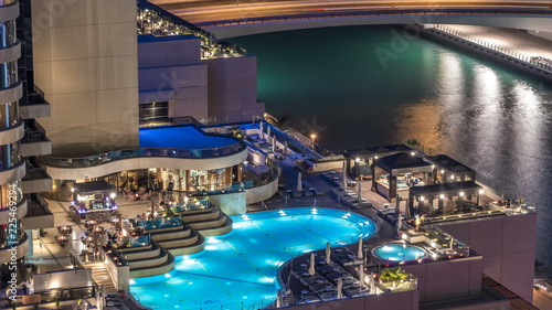 Photography View of skyscrapers with swimming pool in Dubai Marina timelapse